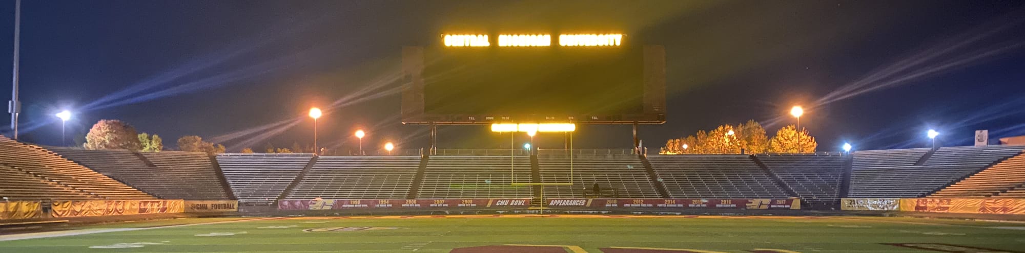 empty football stadium at night under the lights Anchorage